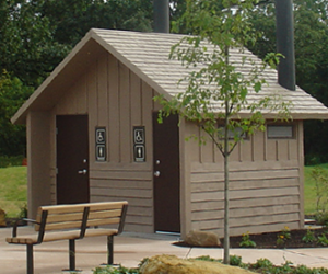 washroom building with Board and batt upper walls, horizontal lap lower walls with cedar shake roof