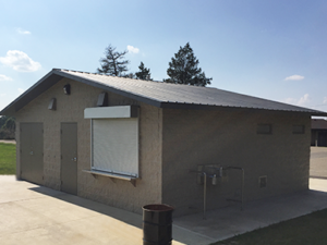 concession stand with Split face block walls with cedar shake roof