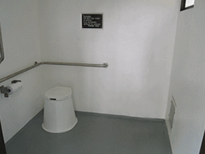 washroom building with Board and batt walls with cedar shake roof